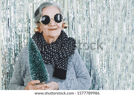 Happy Elderly Asian woman in Christmas party.