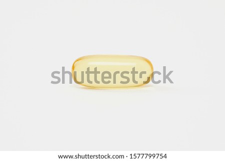  A grain of Fish Oil on white background Royalty-Free Stock Photo #1577799754