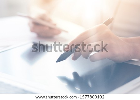 Close up shot of man hands holding and point with stylus on modern electronic digital frame with blank screen, programmer or designer working online at home, doing new project, using wireless Internet