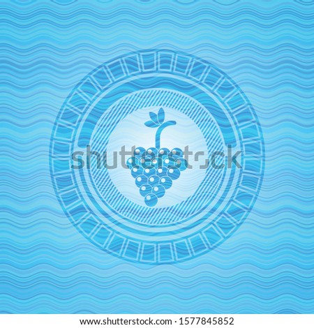 bunch of grapes icon inside water wave representation badge.