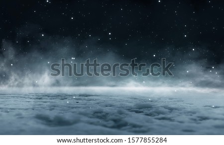 Empty night nature scene. The night starry sky, the rays of the blue neon spotlight. Snowy winter night background. Royalty-Free Stock Photo #1577855284