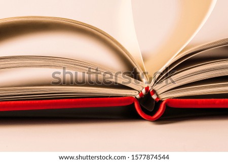 Close up open books on white background