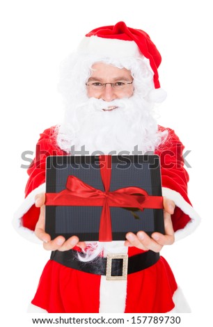 Santa holding digital tablet on white background