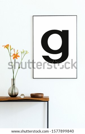 Modern scandinavian interior of living room with wooden console, flowers in vase and elegant personal accessories. Stylish mock up poster frame. White walls. Design home decor. Template. 
