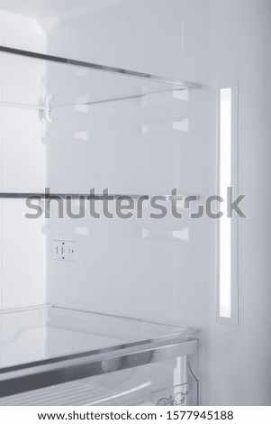 New Refrigerator Isolated on White Background. Modern Kitchen and Domestic Major Appliances