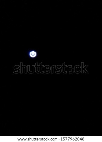 a power button backlighted on a machine