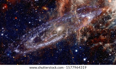 Giant spiral disk of stars, dust and gas. Elements of this image furnished by NASA