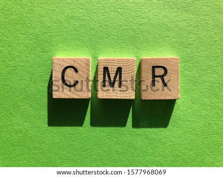 Business acronym, CMR Contract Management Review  or Clear Motion Rate, in 3d wooden alphabet letters on a green background