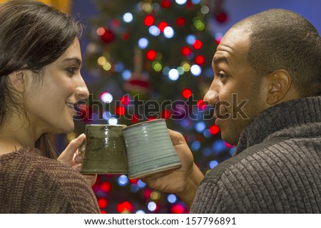 Couple toasting to holidays, horizontal