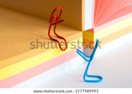 Paper Clips and Blank of Note Papers. Romantic workplace relationship concept, romance at the office concept Royalty-Free Stock Photo #1577989993