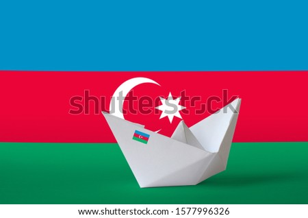 Azerbaijan flag depicted on paper origami ship closeup. Handmade arts concept