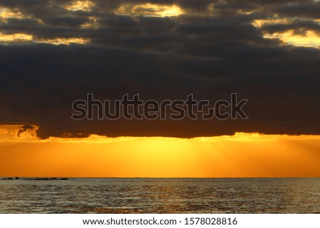 The sun sets over the horizon in the Mediterranean Sea in northern Israel