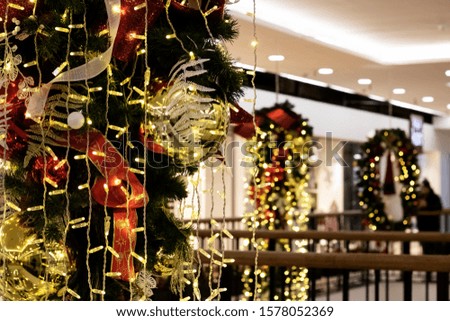Balls and ribbons on Christmas tree, festive decoration