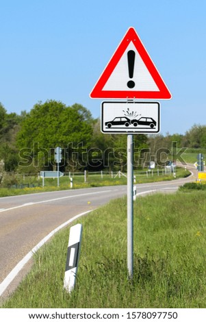 Attention dangerous street with a car crash sign