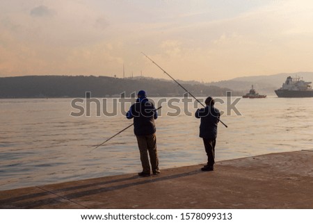 Men are fishing on the coast of Bosporus in Tarabya, Istanbul, Turkey