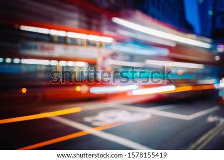 Abstract blurred view of people and traffic during rush hour in a big city