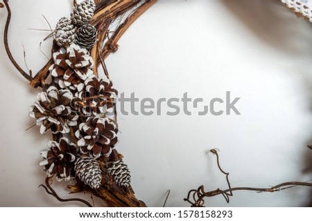 Pinecones decoration on Christmas nature wreath on a white background.