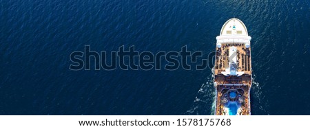 Aerial drone panoramic photo of cruise liner cruising in open ocean deep blue sea