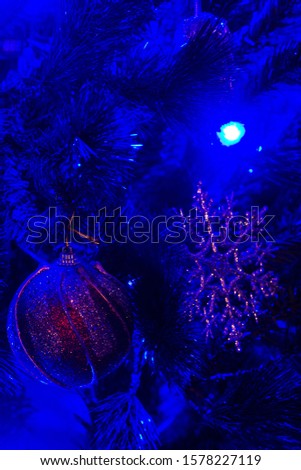 Close-up of Blue lighted Christmas tree decorations. Christmas Background.