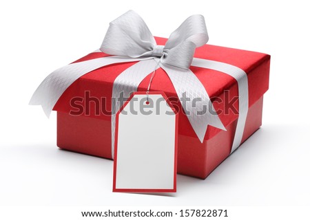 Red gift box with silver bow and tag Royalty-Free Stock Photo #157822871