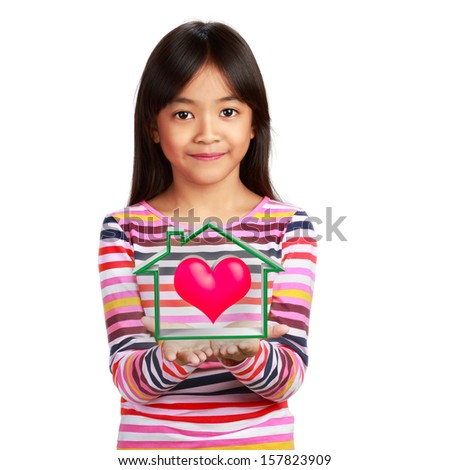 Happy little asian girl with virtual house, warm heart family concept