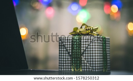 Festive gift box gift box laptop background bokeh Gift Giving Concept Important moments for the festival
