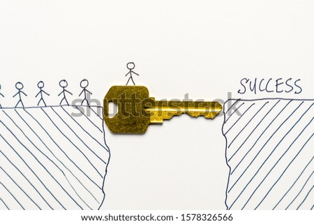 Group of tiny people walking through a golden key to success