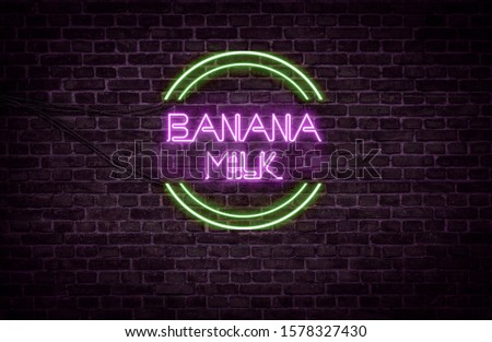 A green and purple neon light sign that reads:
Banana Milk