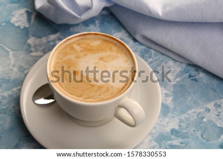 Delicious hot coffee cup on table