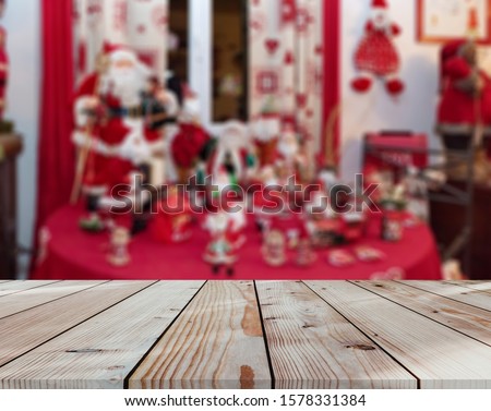 rustic wood table in front of christmas light night

