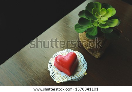 In special occasion coffee shop having chocolate heart shape cake for customers