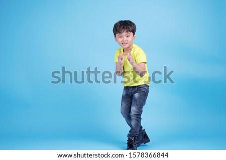 Young asian boy smile gesture hands show exciting