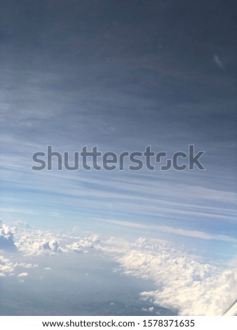 Picture taken while flying over the clouds.