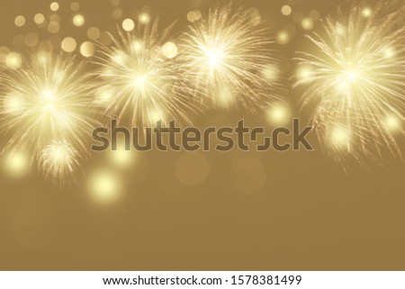 colorful fireworks display with golden bokeh background, celebration concept