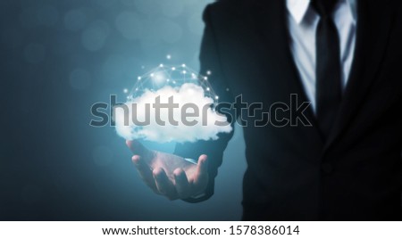Cloud computing and technology network connection concept. Businessman hand holding cloud server tranfer data device