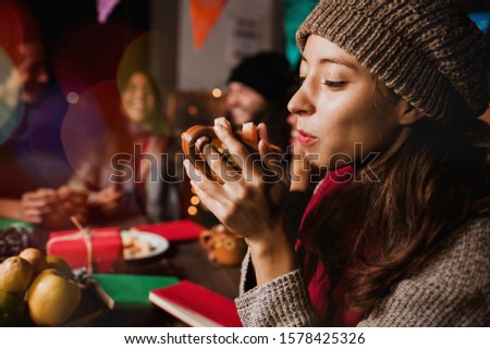 Navidad mexicana, Woman drinking Ponche Navideño celebrating a Posada in Christmas Mexico
