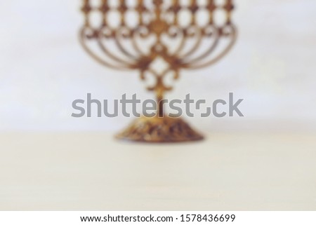 religion image of bokeh blured background with jewish holiday Hanukkah menorah (traditional candelabra). For product display