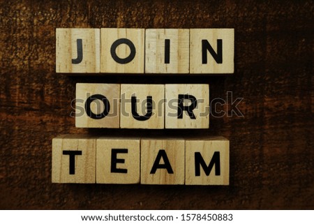 Join Our Team alphabet letters on wooden background