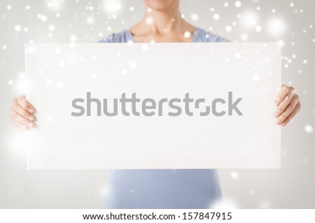 shopping, sale, advertisement, christmas, x-mas concept - woman hands showing white blank board