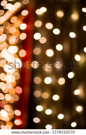 Christmas home room with tree and festive bokeh lighting, blurred holiday background. Template