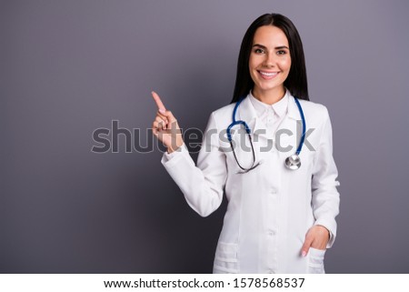 Portrait of her she nice attractive lovely pretty cheerful cheery brunet girl showing copy space professional medical expert consultation isolated on grey pastel color background