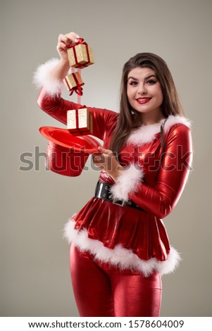 Santa girl with presents for Christmas