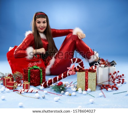 Santa girl with presents for Christmas