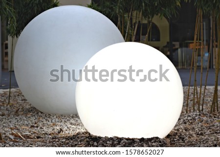 
shining ball on the pebble