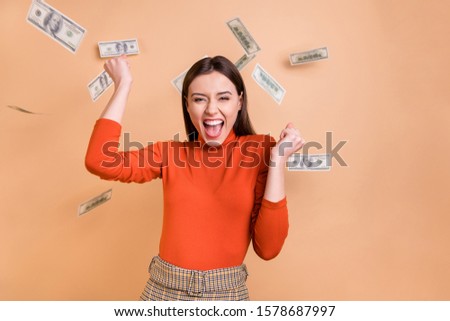 Photo of cheerful nice charming cute fascinating lawyer having received her wage living carefree wearing red turtleneck isolated beige pastel color background