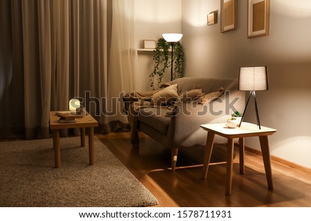 Stylish interior of living room at night Royalty-Free Stock Photo #1578711931