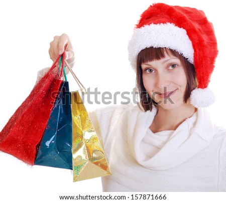 The girl in the hat of Santa Claus with holiday gifts isolated on a white background. Christmas and New Year
