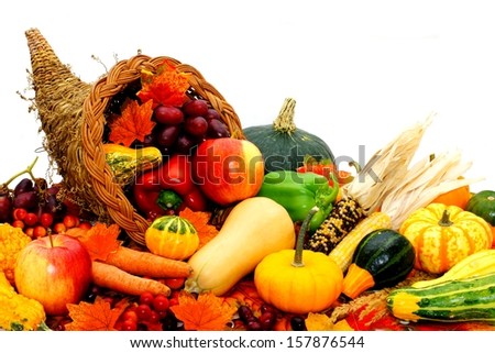 Harvest cornucopia filled with assorted vegetables and fruit
