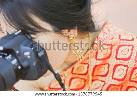 A woman with a camera