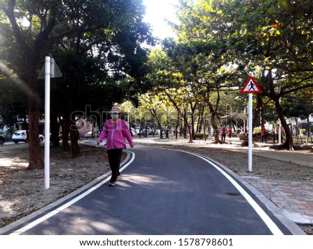 Pedestrian walking triangle road sign. Pedestrian zone in Taiwan park, pedestrian only